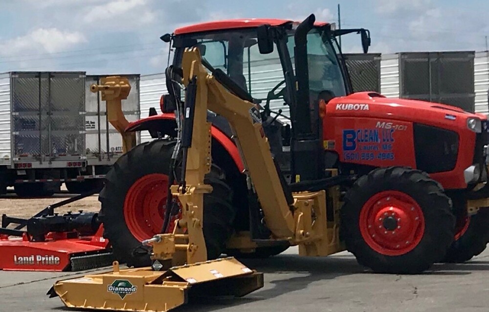 brush hog parked in a parking lot